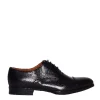 Scarpe classiche in pelle nera con suola in gomma